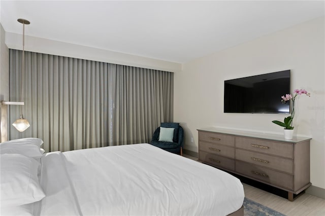 bedroom with light hardwood / wood-style floors