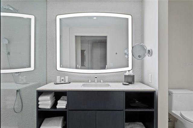 bathroom featuring toilet and vanity