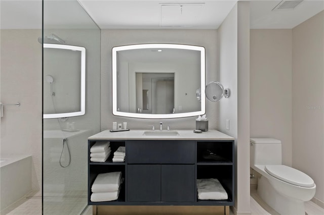 bathroom featuring toilet and vanity with extensive cabinet space