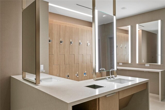 bathroom featuring tile floors and vanity