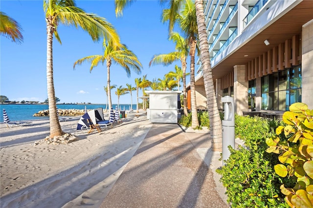 exterior space with a balcony and a water view