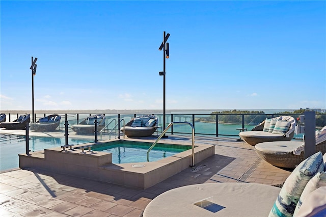 view of pool featuring a hot tub