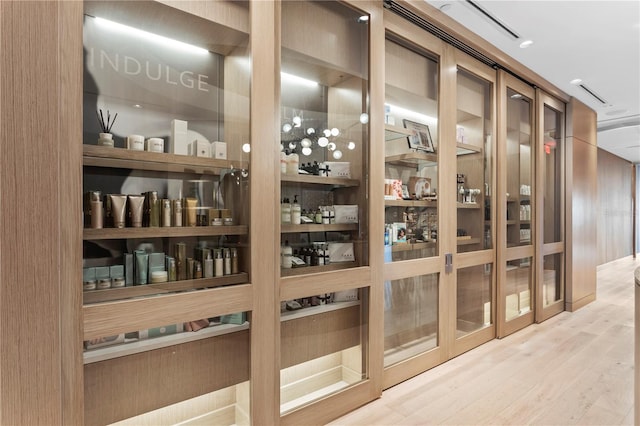 wine room with light wood-type flooring