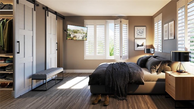 bedroom featuring a barn door, multiple windows, and dark hardwood / wood-style flooring