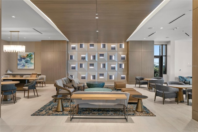 interior space with light tile floors and a notable chandelier