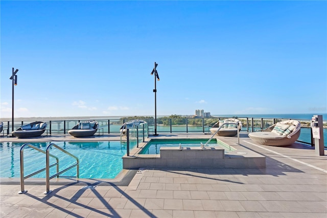 view of pool featuring an in ground hot tub