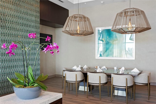 dining space with dark wood-type flooring