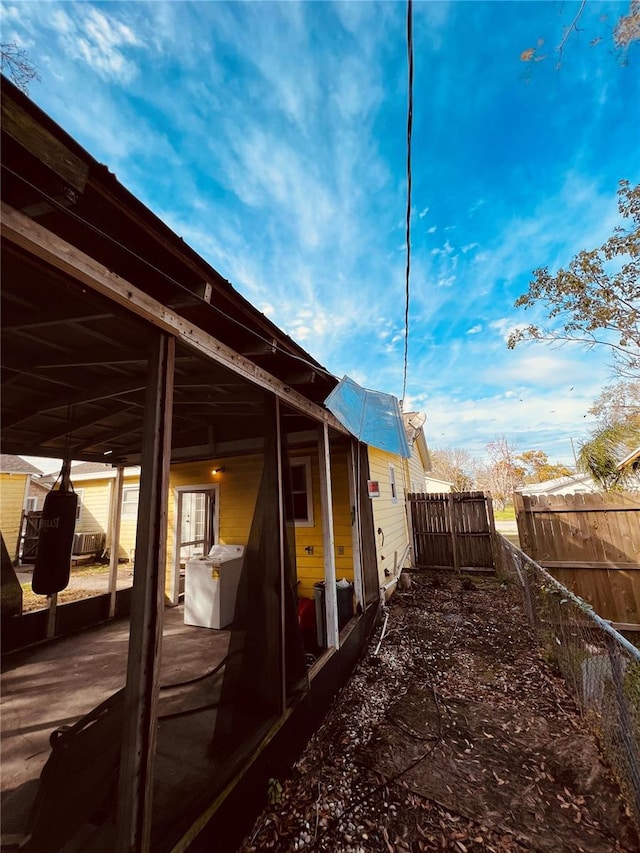 view of side of property with a patio area