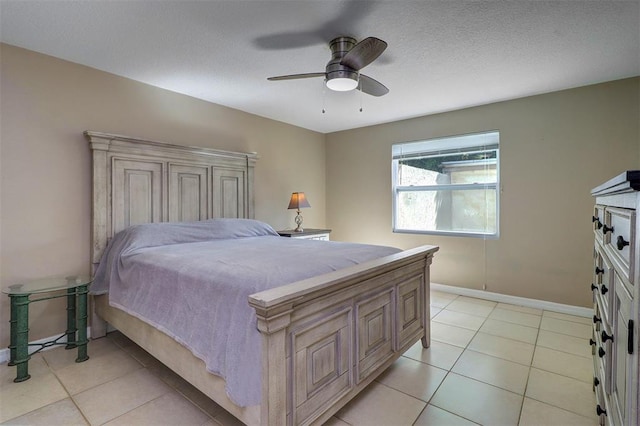 tiled bedroom featuring ceiling fan