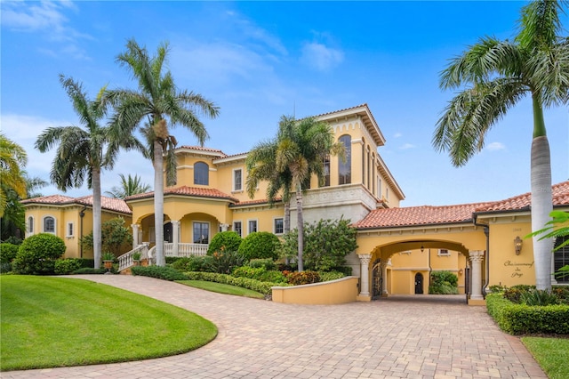 mediterranean / spanish home with covered porch