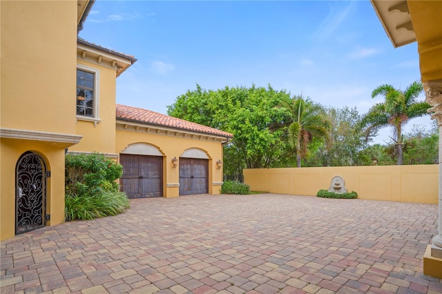 view of patio / terrace featuring a garage