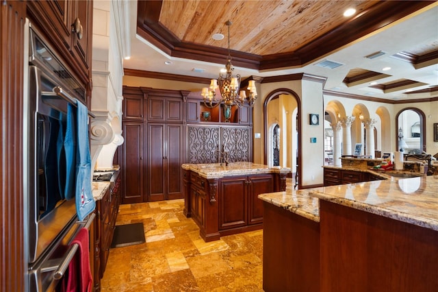 bar featuring light stone countertops, crown molding, hanging light fixtures, and a chandelier