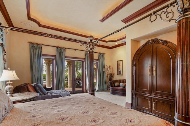 carpeted bedroom featuring french doors, access to outside, a tray ceiling, and ornamental molding