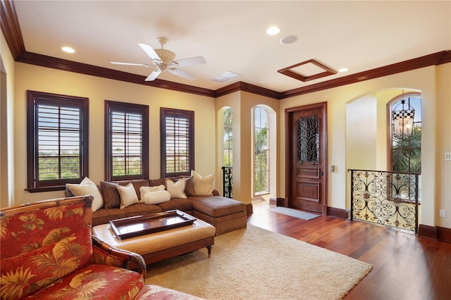 living room with ceiling fan, hardwood / wood-style floors, and ornamental molding