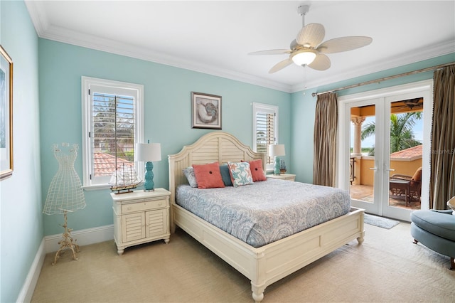 carpeted bedroom featuring ceiling fan, multiple windows, and french doors