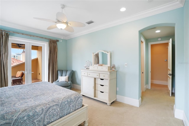 carpeted bedroom with ceiling fan, ornamental molding, and french doors