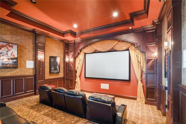 carpeted home theater room with crown molding