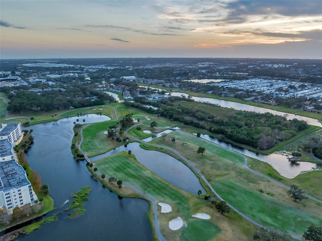 aerial view at dusk with a water view