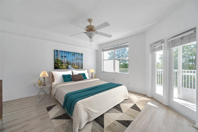 bedroom with access to outside, light hardwood / wood-style floors, and ceiling fan