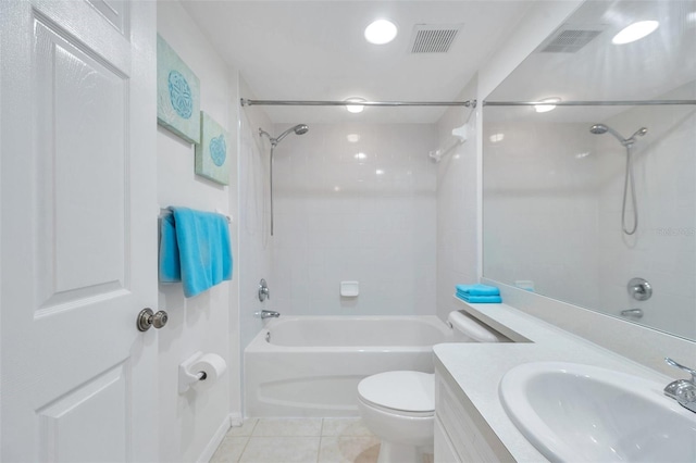 full bathroom with toilet, tile flooring, tiled shower / bath combo, and vanity