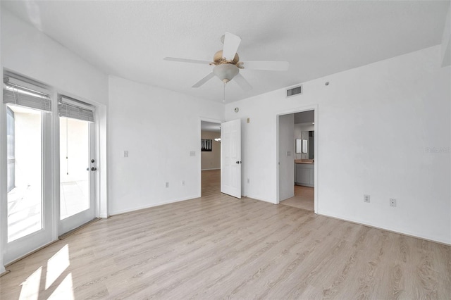 unfurnished bedroom with ceiling fan, access to outside, ensuite bath, and light hardwood / wood-style floors