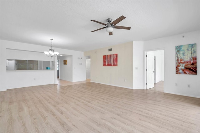 unfurnished living room featuring a textured ceiling, ceiling fan with notable chandelier, and light hardwood / wood-style floors