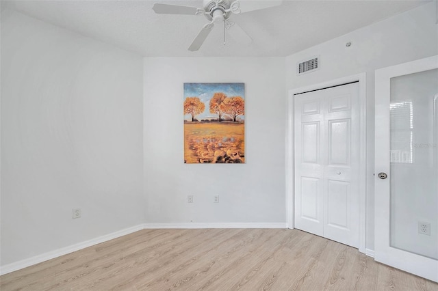 interior space featuring ceiling fan and light hardwood / wood-style flooring