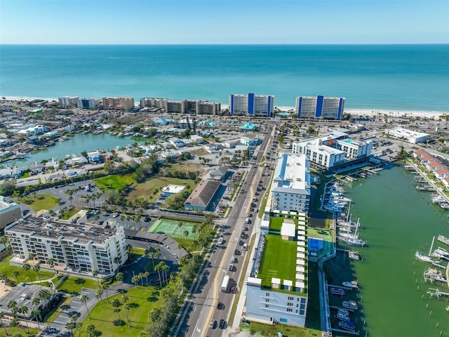 birds eye view of property featuring a water view and a view of city