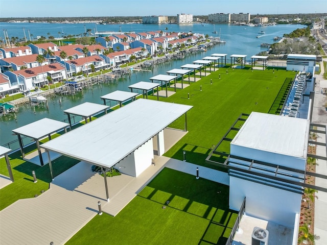 birds eye view of property featuring a water view and a residential view