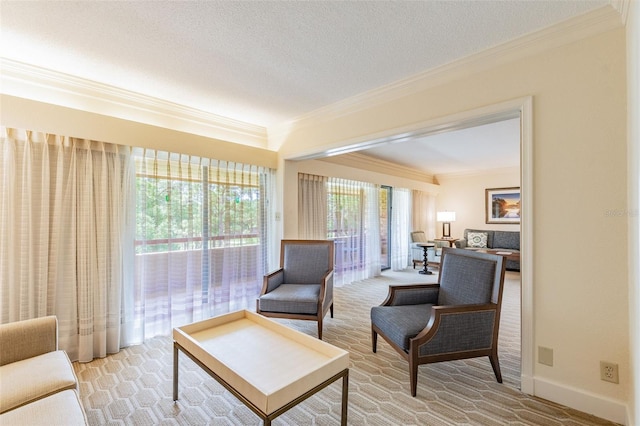 living area with a textured ceiling, baseboards, light colored carpet, and crown molding