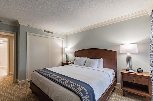 bedroom featuring baseboards, crown molding, a textured ceiling, dark carpet, and a closet