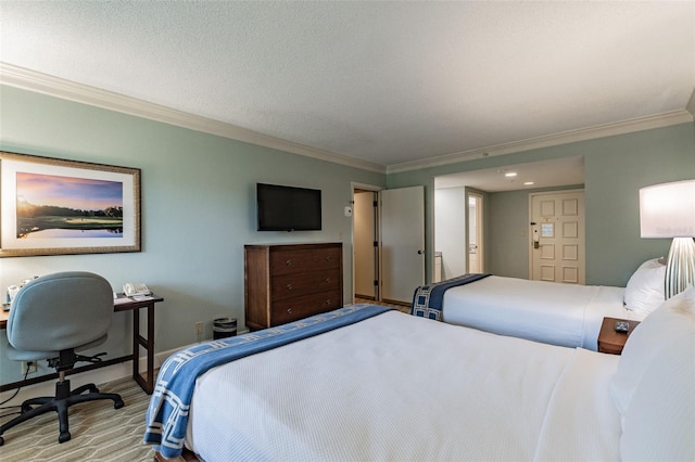 bedroom featuring ornamental molding, a textured ceiling, and baseboards