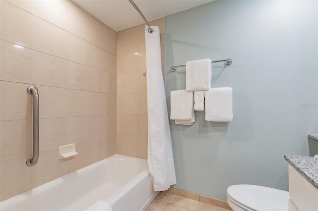 bathroom with baseboards, shower / bathtub combination with curtain, toilet, and tile patterned floors