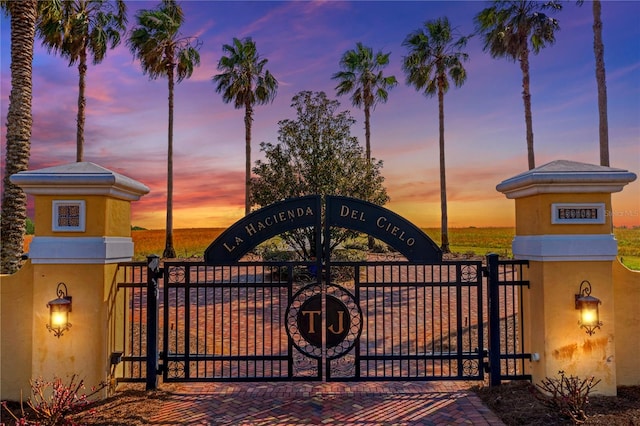 view of gate at dusk