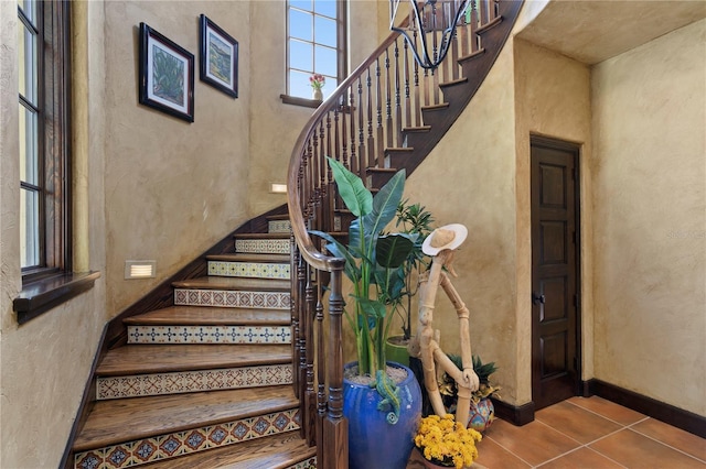 stairs featuring tile patterned floors