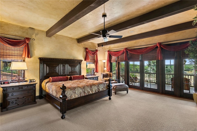 bedroom featuring ceiling fan, multiple windows, beam ceiling, and access to outside