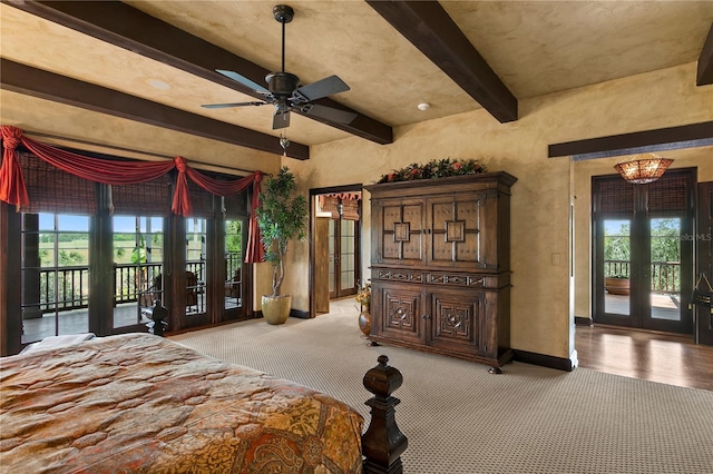 unfurnished bedroom with light colored carpet, access to exterior, french doors, and ceiling fan with notable chandelier