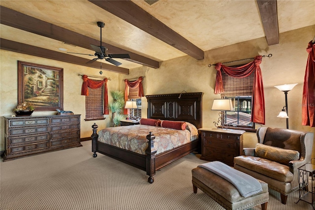 bedroom with ceiling fan, light carpet, and beam ceiling