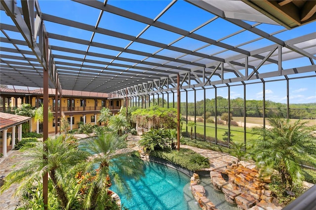 view of swimming pool with glass enclosure