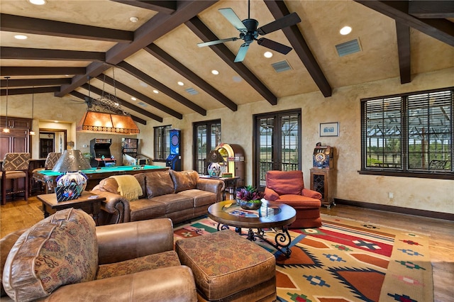 living room with light wood-type flooring, ceiling fan, and lofted ceiling with beams