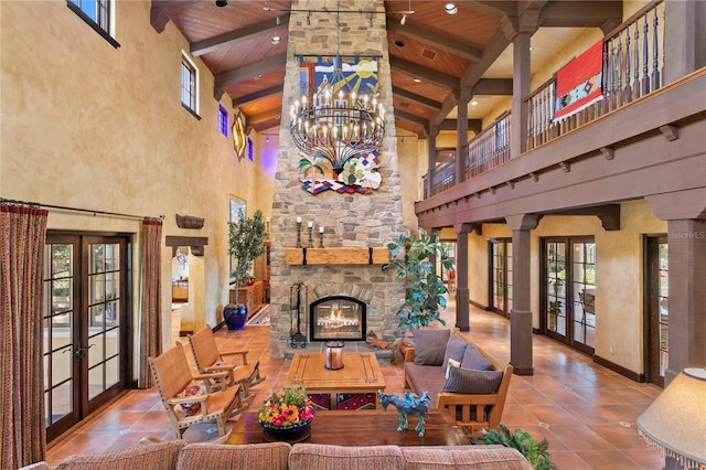 tiled living room with high vaulted ceiling, french doors, and wooden ceiling