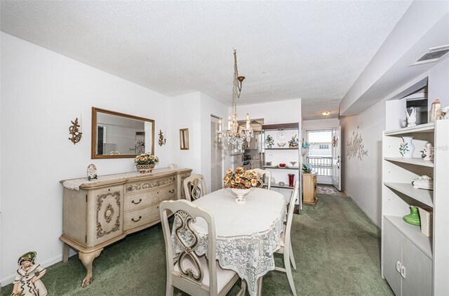 carpeted dining space with an inviting chandelier and a textured ceiling