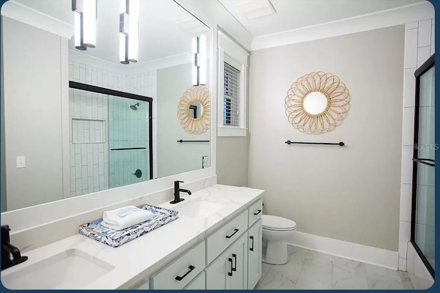 bathroom with ornamental molding, vanity, toilet, and a shower with door