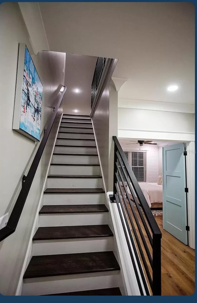 stairway featuring hardwood / wood-style flooring