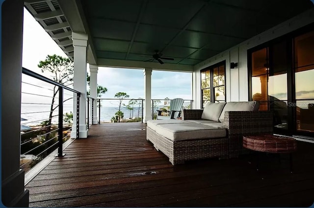 deck featuring an outdoor living space and ceiling fan