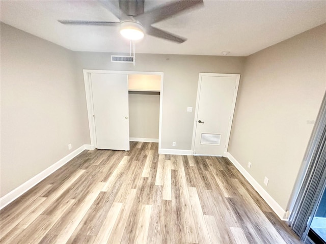 unfurnished bedroom with a closet, ceiling fan, and light hardwood / wood-style flooring