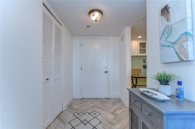 foyer featuring light parquet floors