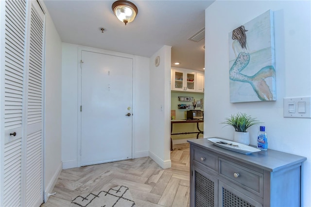 entryway featuring light parquet flooring