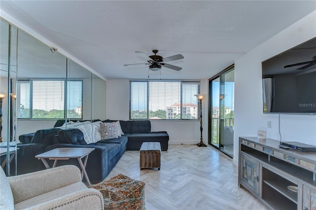 living room featuring light parquet floors and ceiling fan