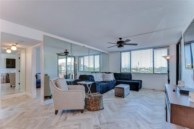 living room featuring light parquet flooring and ceiling fan